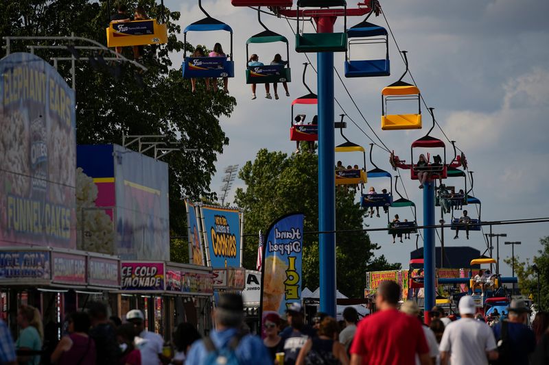 Jul 30, 2024; Columbus, Ohio, USA; Visitors take a half-mile ride across the fairgrounds on the SkyGlider at the Ohio State Fair.