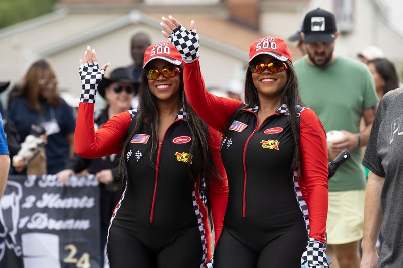 Hundreds of pairs of twins march in the Twins Days Festival Double Take parade Saturday morning, August 3, 2024 in Twinsburg, OH.