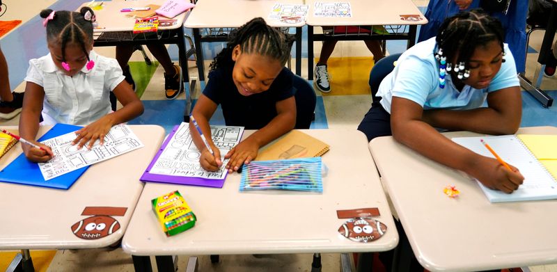 Students at Bond Hill Academy on their first day of school, Wednesday, August 14, 2024.