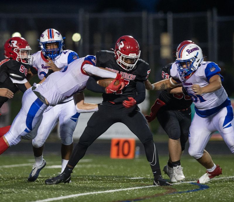 Kent's Ke'Shan Talbert with possession, Robert Melzer on defense on Friday, August 23.