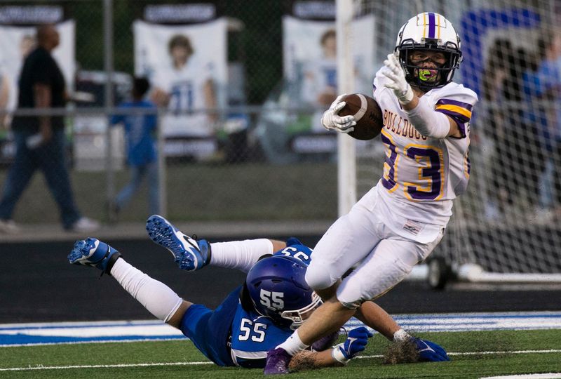 Bloom-Carroll's Rusty Hutchinson (83) escapes the tackle of a Chillicothe defender in varsity football action as the Cavaliers hosted the Bulldogs on August 23, 2024, in Chillicothe, Ohio.