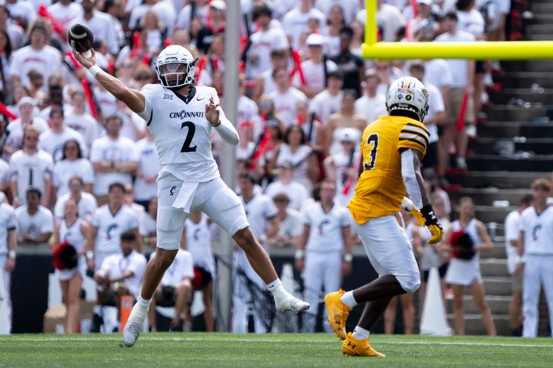 Cincinnati Bearcats quarterback Brendan Sorsby throws a pass in the first quarter of a game against the Towson Tigers.