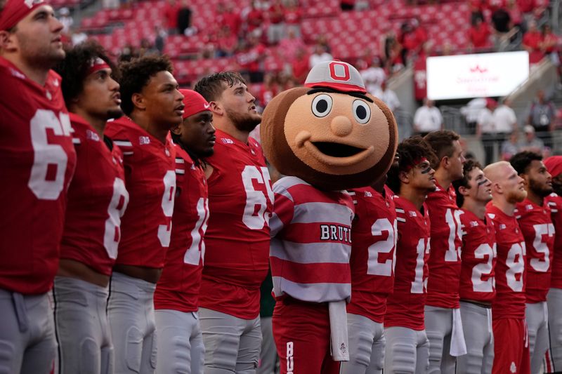 Aug 31, 2024; Columbus, OH, USA; Ohio State Buckeyes mascot Brutus sings "Carmen Ohio" with his kids following the NCAA football game against the Akron Zips at Ohio Stadium. Ohio State won 52-6.