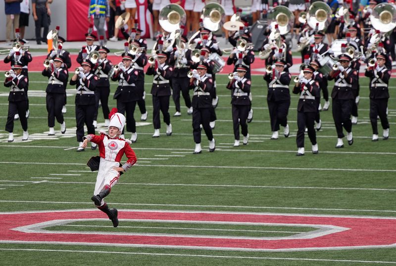 Aug 31, 2024; Columbus, OH, USA; Drum major Clayton Callendar leads the Ohio State Marching Band onto the field prior to the NCAA football game between the Ohio State Buckeyes and the Akron Zips at Ohio Stadium.