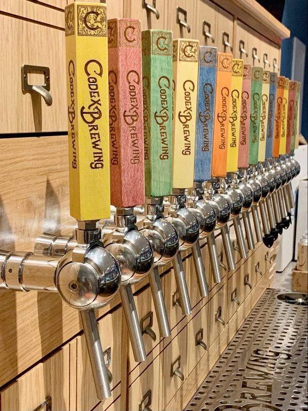 Codex Brewing features a wide selection of craft brews and drive-thru beer pickup available during taproom hours.