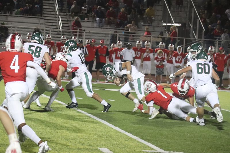 Oak Harbor's Blake Nickel carries the ball.