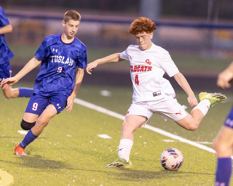 Canton South's Guillermo Graves winds up to score a goal in the first half a with pressure from Tuslaw's Tate Neuenschwander at Tuslaw, Wednesday, September 18, 2024.