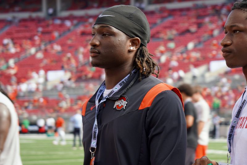 Sept. 21, 2024; Columbus, Ohio, USA; Glenville linebacker Cincere Johnson watches warm-ups before Ohio State's game against the Marshall University Thundering Herd at Ohio Stadium.