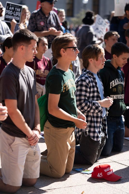 Students from Walsh University, Franciscan University and others, prayed in front of counter protesters at the 2024 March for Life in Columbus. Abortion opponents are introducing a bill to ban all abortions and treat abortion as a homicide.