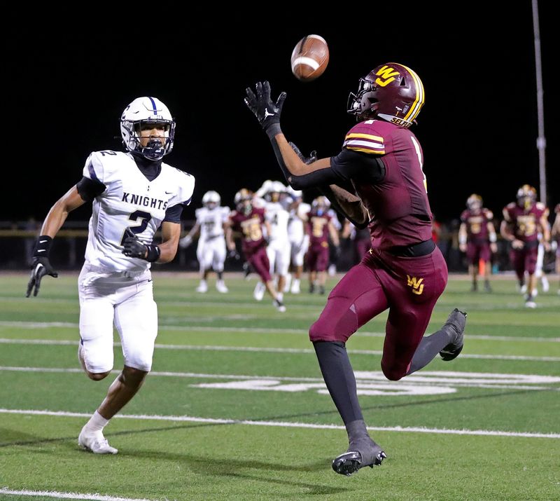 Walsh Jesuit wide receiver Milan Parris catches a pass for a first down as Hoban defensive back John Johnson tries to defend Oct. 4, 2024, in Cuyahoga Falls, Ohio.