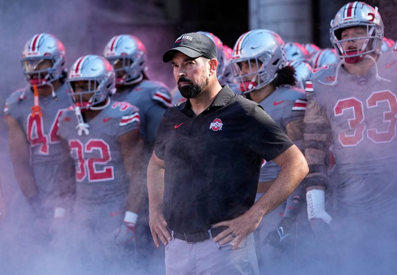 Oct 5, 2024; Columbus, OH, USA; Ohio State Buckeyes head coach Ryan Day prepares to lead his team on the field prior to the NCAA football game against the Iowa Hawkeyes at Ohio Stadium.