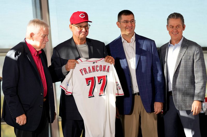 New Cincinnat Reds manager Terry Francona holds his new jersey on stage with (left to right) team owner Bob Castellini, President of Baseball Operation, Nick Krall, and General Manager Brad Meador, during an event to introduce the new manager of the Cincinnati Reds at Great American Ball Park in downtown Cincinnati on Monday, Oct. 7, 2024.