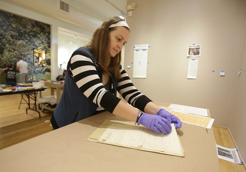 Mandy Alltimus Stahl , Archivist at the Massillon Museum puts together a display of Freedom Papers for slaves from Virginia that moved to Massillon.