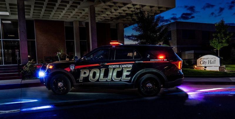 The North Canton Police Department won a statewide photo contest with this picture of its cruiser No. 2 in front of North Canton City Hall in the evening of the Main Street Festival in August.