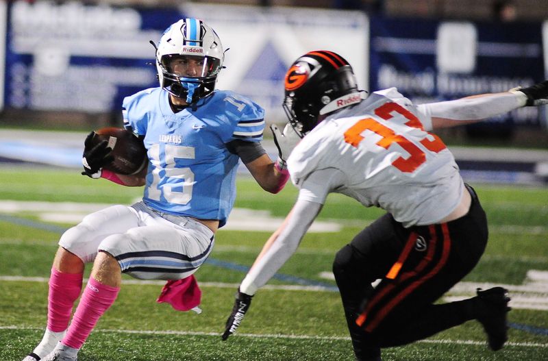 Louisville's Owen DiMarzio makes a cut to avoid Green's Kam Worner, Friday, Oct. 11, 2024.