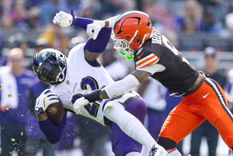 Cleveland Browns safety Grant Delpit (9) tackles Baltimore Ravens running back Derrick Henry (22) on Oct. 27, 2024, in Cleveland, Ohio.