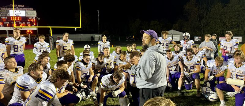 The scoreboard says it all in the background as Bloom-Carroll coach Jeremy McKinney talks to his team after their victory over Circleville.