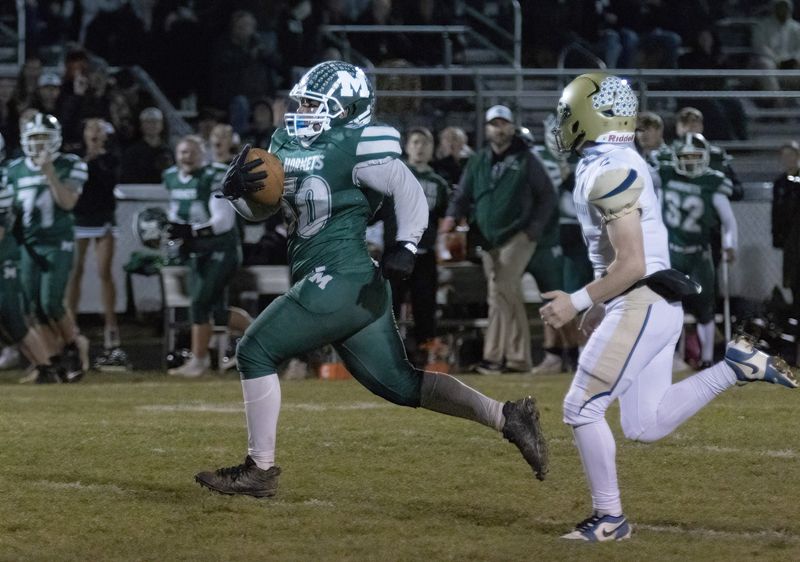 Malvern’s defensive lineman Darnell Jackson takes an interception down to Lowellville’s 9-yard line, Friday, Nov. 8, 2024.