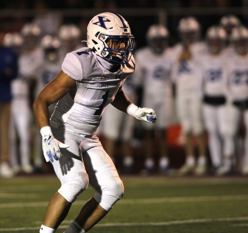 Kobe Clapper and the St. Xavier defense will try to slow down Matt Ponatoski and the Moeller Crusaders Sept. 19.