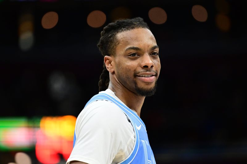 Cleveland Cavaliers guard Darius Garland smiles at fans during a game against the Charlotte Hornets on Nov. 17, 2024, in Cleveland.