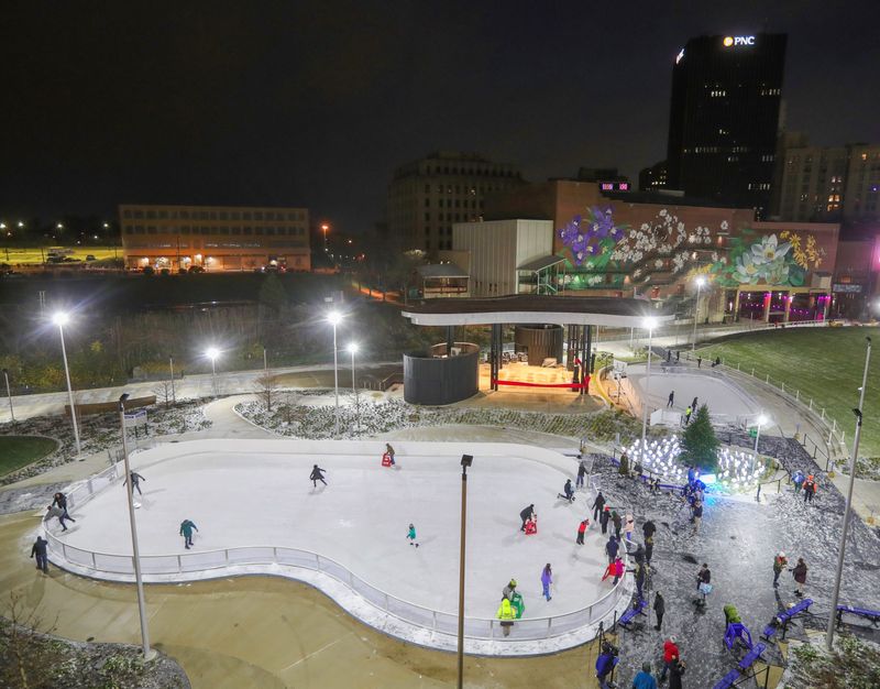 Skaters get in some ice time before the reopening celebration for downtown's Lock 3 Park on Nov. 29, 2024, in Akron.