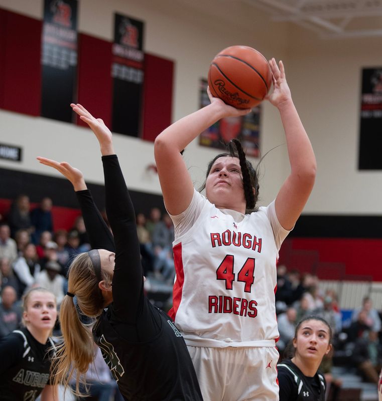 Claire VanDamme takes a shot, Abbey Feckner on defense. Roosevelt hosted Aurora for girls basketball in Kent on Friday, Dec. 13.