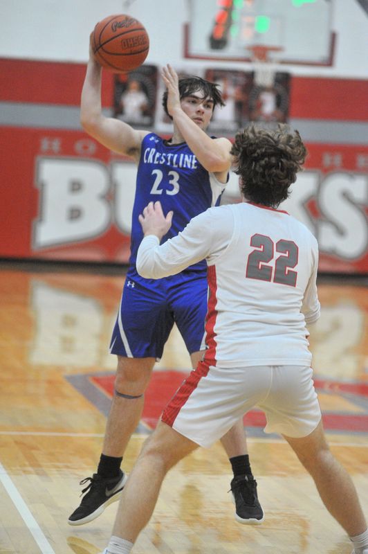 Crestline's Quentin Kapp dishes the ball inside over Buckeye Central's Jeremiah Fishpaw.