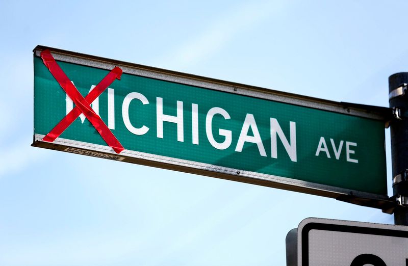 The 'M' of a Michigan Ave. street sign is crossed out with red duct tape in anticipation of the big game on Saturday. The yearly tradition finds crossed out M's on signs on the Ohio State campus, but this street sign at the intersection of Michigan Ave. and King Ave. is close enough for the same treatment. [Fred Squillante/Dispatch]