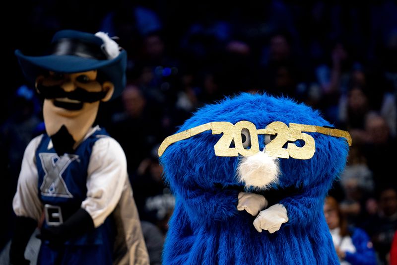 Xavier Musketeers mascot the Big Blue Blob wears glasses for the new year in the second half of the NCAA basketball game against the Seton Hall Pirates at the Cintas Center in Cincinnati on Tuesday, Dec. 31, 2024.