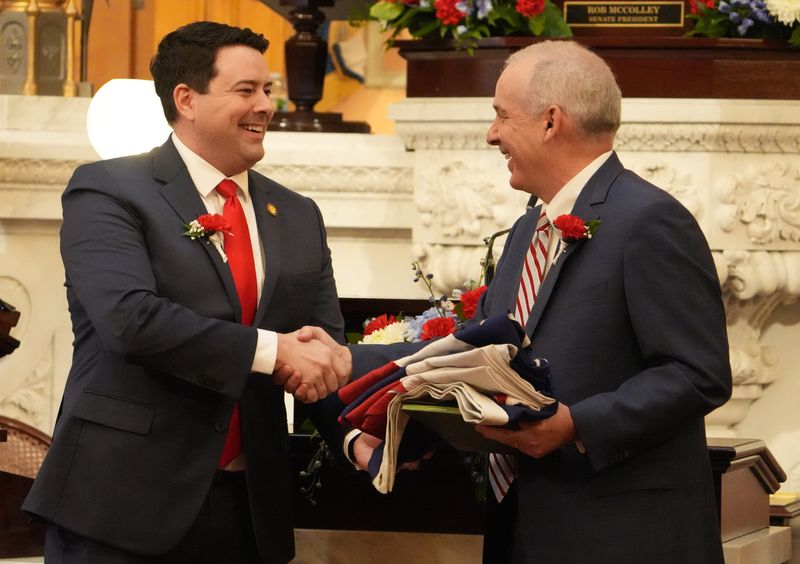 Ohio Senate President Rob McColley, left, R-Napoleon, laughs with new House Speaker Matt Huffman, R-Lima, as the Ohio General Assembly convened on Jan. 6. McColley and Huffman's fellow Republicans scrapped large sections of Gov. Mike DeWine's proposed budget and added new rules for property taxes and a flat income tax.
