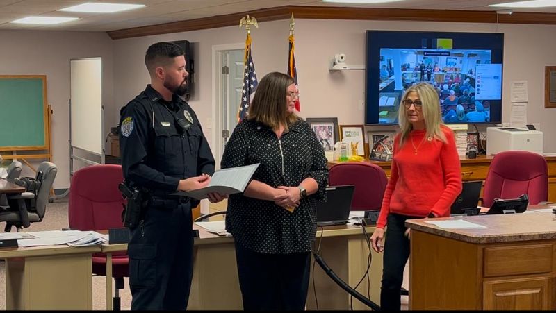 Dover Patrolman Ryan Porter receives a lifesaving award from Erica Van Pelt, operations manager of the Northern Ohio Region of the American Red Cross; and Kimberley Kroh, executive director of the Heartland, Stark, Muskingum Lakes chapter of the American Red Cross, in January 2025.