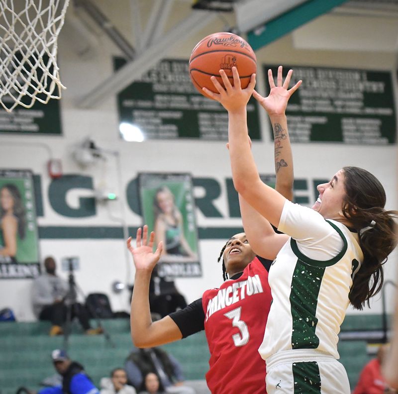 Mason's Anna Habra scores against Princeton. Habra had 14 points in the Comets' 54-43 win over Princeton Wednesday, Jan. 8, 2025, at Mason.