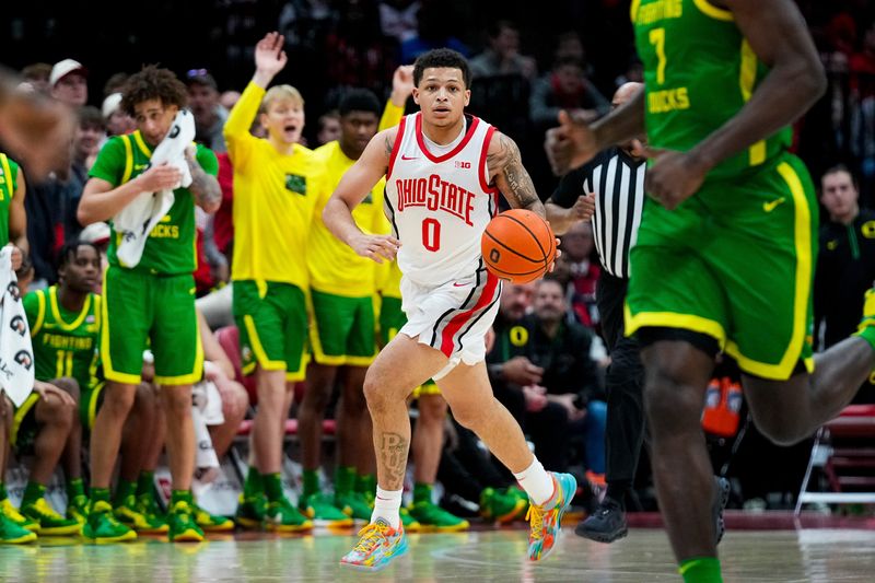 Ohio State Buckeyes guard John Mobley Jr. (0) dribbles the ball against the Oregon Ducks in the second half at Value City Arena on Thursday, Jan. 9, 2025 in Columbus, Ohio.