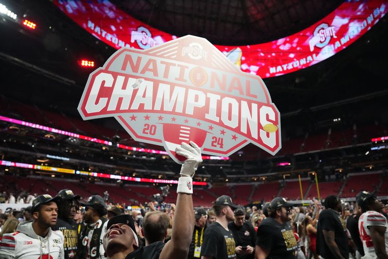 Jan 20, 2025; Atlanta, GA, USA; Ohio State Buckeyes players celebrate after defeating the Notre Dame Fighting Irish in the CFP National Championship college football game at Mercedes-Benz Stadium. Mandatory Credit: Kirby Lee-Imagn Images