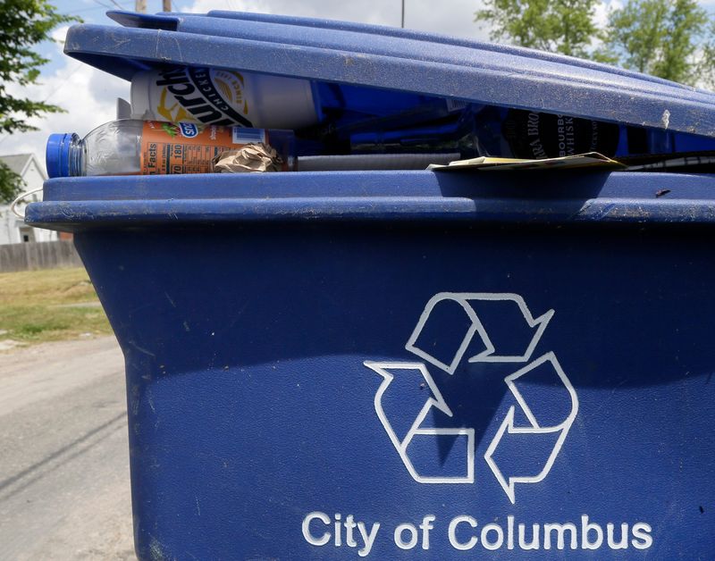 A recycling container is overflowing in the alley between East Kossuth Street and South 18th Street on Columbus' South Side.