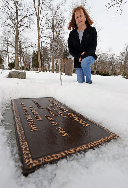 Chris Untrauer looks on at the grave of U.S. Army veteran Willie Ross Dennis that was previously unmarked at Maple Grove Cemetery in this January 2025 file photo.