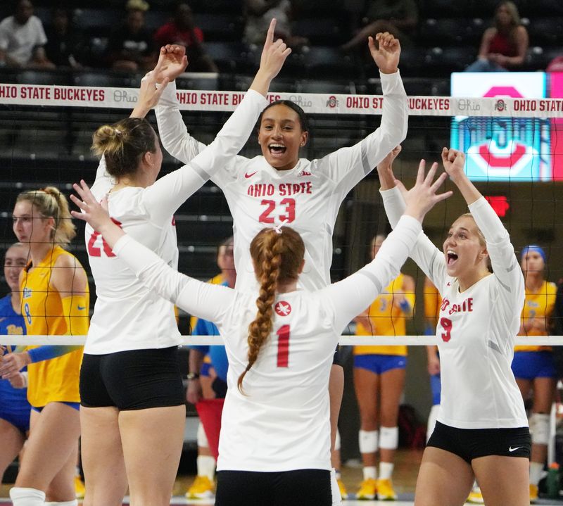 Aug 19, 2023; Columbus, Ohio, United States; Mia Tuman (right) celebrates with. teammates inside the Covelli Center during an exhibition game against Pitt. Tuman is a freshman setter for Ohio State women's volleyball. Her father, Jerame Tuman, played for Michigan football, and Mia grew up a huge Michigan fan. Her mother, Molly Tuman, was a Division 1 volleyball player at Kentucky.