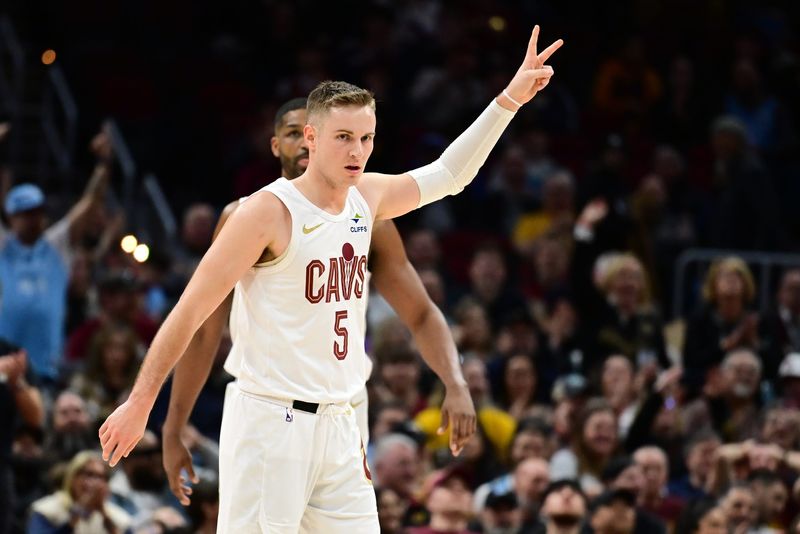 Feb 2, 2025; Cleveland, Ohio, USA; Cleveland Cavaliers guard Sam Merrill (5) celebrates after hitting a three point basket during the second half against the Dallas Mavericks at Rocket Mortgage FieldHouse. Mandatory Credit: Ken Blaze-Imagn Images