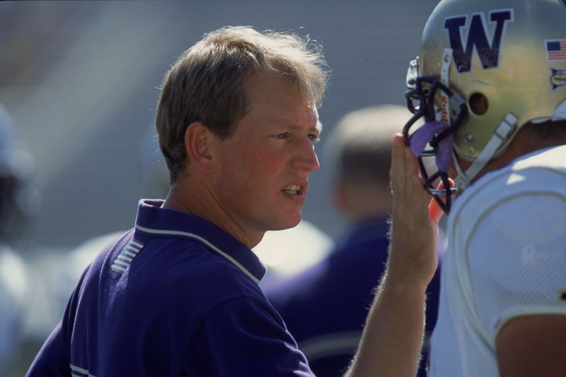 13 Oct 2001: Head Coach Rick Neuheisel of the Washington Huskies gives advice to Zach Tuiasosopo #5 during the game against the University of California Los Angeles (UCLA) Bruins at the Rose Bowl in Pasadena, California. The Bruins defeated the Huskies 35-13.Mandatory Credit: Stephen Dunn /Allsport