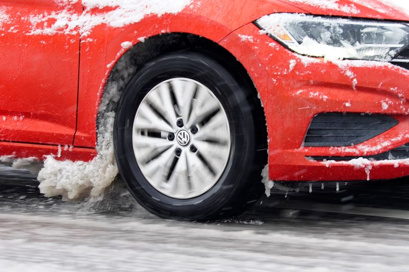 Vehicles encountered slick conditions on Hunt Road in Blue Ash, after rain turned to snow, Sunday, Feb. 16, 2025.