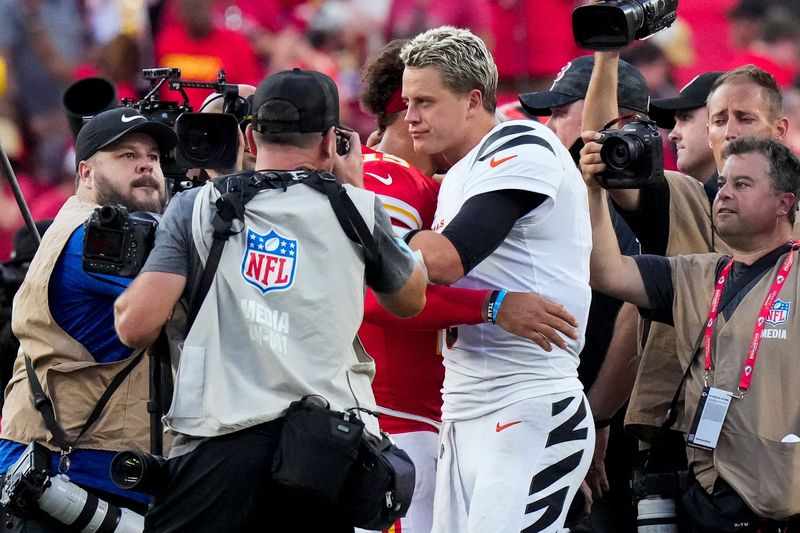 Cincinnati Bengals quarterback Joe Burrow (9) and Kansas City Chiefs quarterback Patrick Mahomes (15) hug at midfield after the fourth quarter of the NFL Week 2 game between the Kansas City Chiefs and the Cincinnati Bengals at Arrowhead Stadium in Kansas City on Sunday, Sept. 15, 2024. The Chiefs took a 26-25 win with a go-ahead field goal as time expired.
