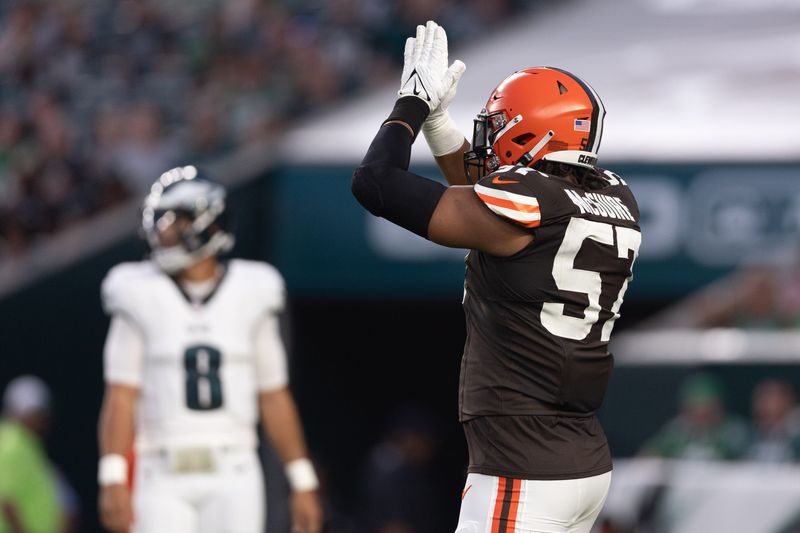 Aug 17, 2023; Philadelphia, Pennsylvania, USA; Cleveland Browns defensive end Isaiah McGuire (57) signals for a safety against the Philadelphia Eagles during the first quarter at Lincoln Financial Field. Mandatory Credit: Bill Streicher-USA TODAY Sports