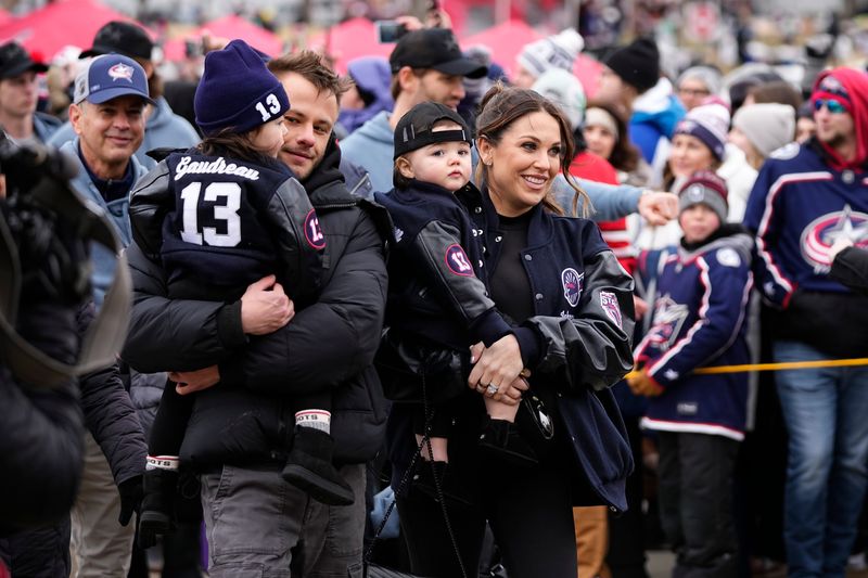 The Gaudreau family leads the Blue Jackets to Ohio Stadium prior to the NHL Stadium Series game against the Red Wings on March 1.