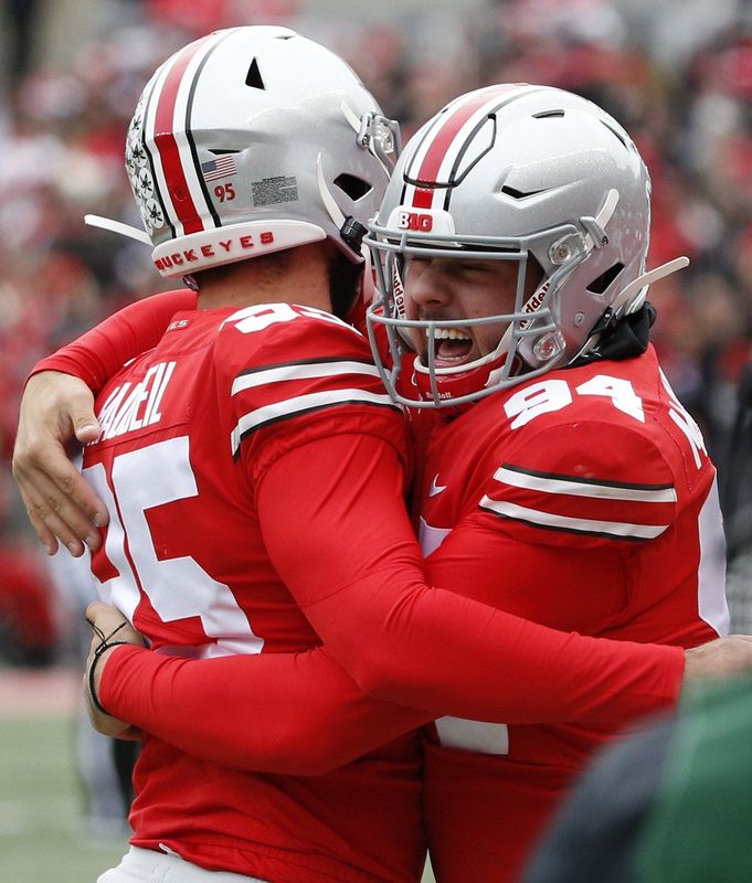 Former Ohio State Buckeyes long snapper Michael Roen McCullough (right) was arrested Friday, Aug. 29 on charges that accuse him of trying to strangle his girlfriend.
