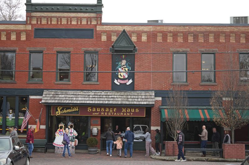 Patrons line up outside as Schmidt's Restaurant und Sausage Haus opens on March 7, 2025.