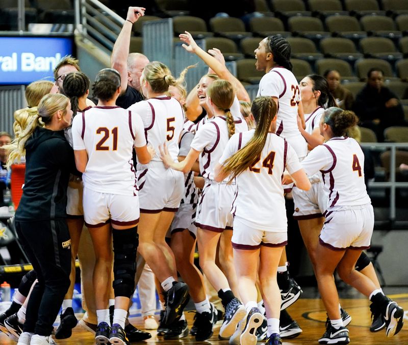 The Cooper Lady Jaguars celebrate after defeating the Notre Dame Academy Pandas 60-57 during a Kentucky Ninth Region girls basketball final game, Friday, March 7, 2025, at Truist Arena in Highland Heights, Ky.