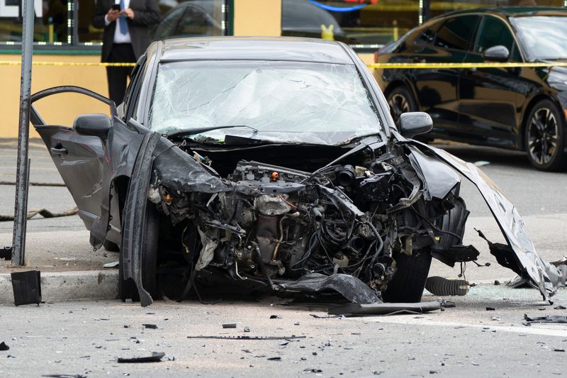 Damage on the front of a vehicle is seen during an investigation of a vehicle crash involving 5 cars at the intersection of Getty Ave and Crooks Ave on Wednesday, March 12, 2025.