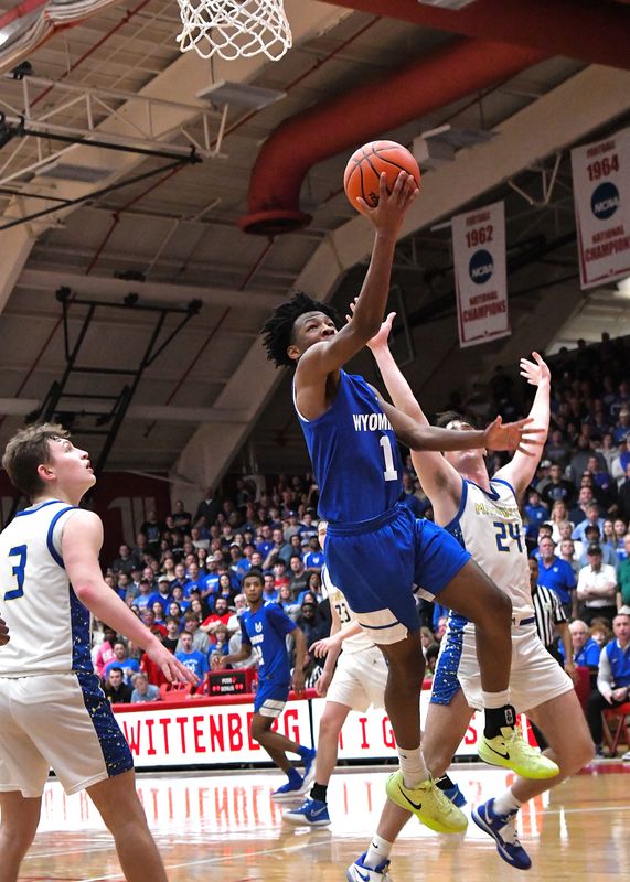 Wyoming's Kellen Wiley drive to the hoop in the second overtime as the Cowboys fall to Maysville at the boys OHSAA Division IV basketball state semifinals, Wittenberg University, March 14, 2025.