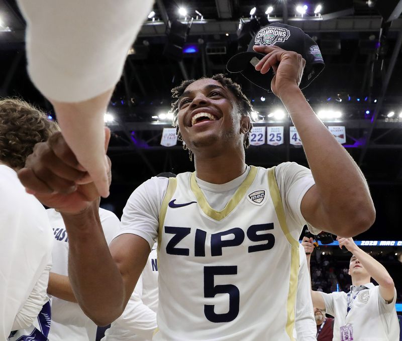 Akron Zips guard Tavari Johnson (5) celebrates winning the Mid-American Conference Tournament championship game at Rocket Arena on Saturday, March 15, 2025, in Cleveland, Ohio.