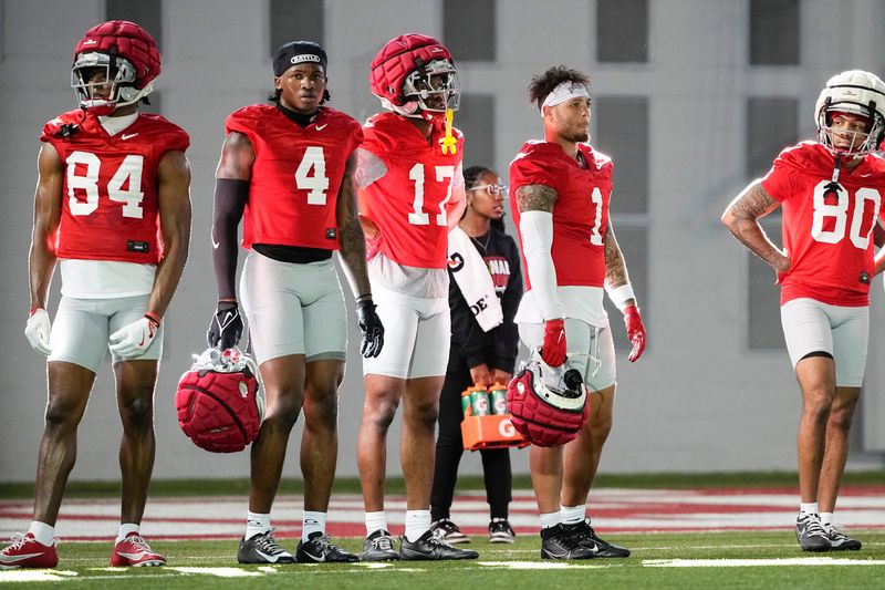 Ohio State Buckeyes wide receivers Dorian Williams (84), Jeremiah Smith (4), Carnell Tate (17), Brandon Inniss (1) and Shawn Lodge (80) watch during spring football practice at the Woody Hayes Athletic Center on March 17, 2025.